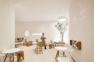 自然简洁奶茶店座位区装修设计图