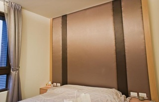 咖色简约风卧室 床头背景墙设计