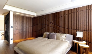 时尚现代卧室实木背景墙装饰图