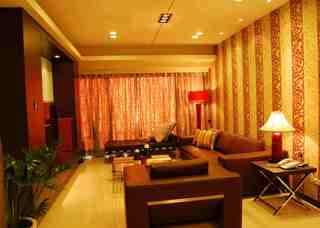 橘黄色现代时尚二居客厅软装装饰效果图