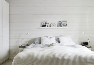 简约北欧风小户型卧室白色背景墙效果图