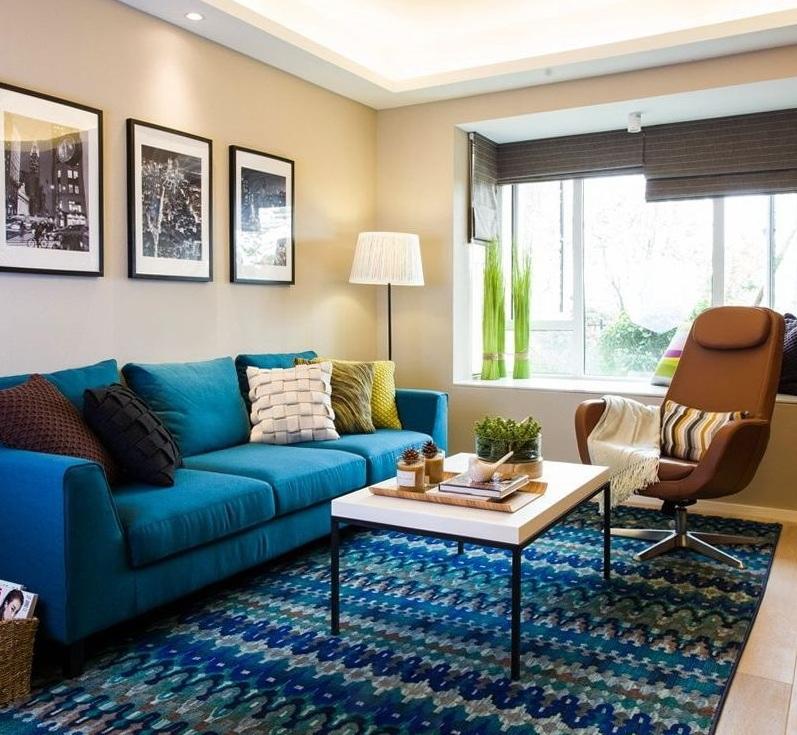 蓝色主题美式清新客厅沙发相片墙效果图